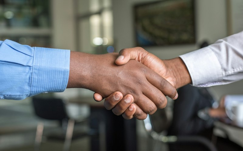 Two businesspeople shaking hands